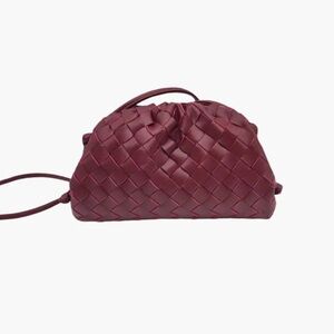 Mini burgundy, leather woven purse. May be worn as a clutch or Crossbody bag.